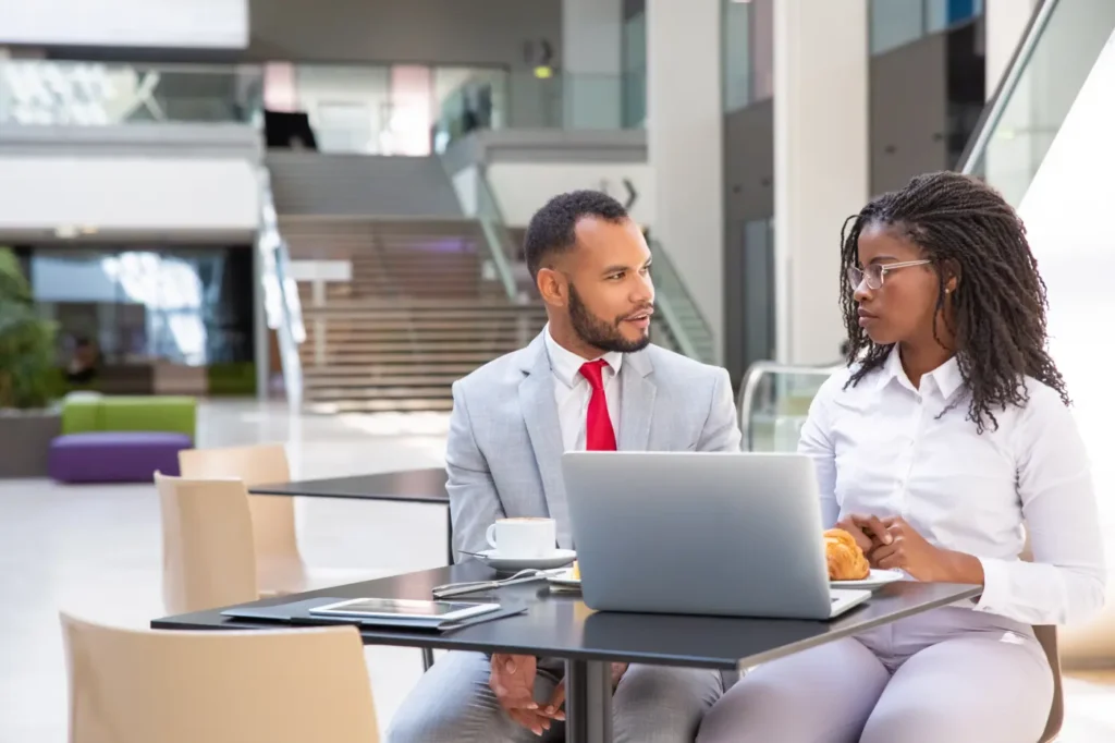 diverse-office-employees-discussing-project
